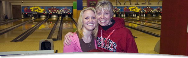 student with mom in bowling alley