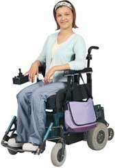 young woman sitting in wheelchair smiling