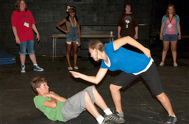 High School Theatre workshop students rehearsing