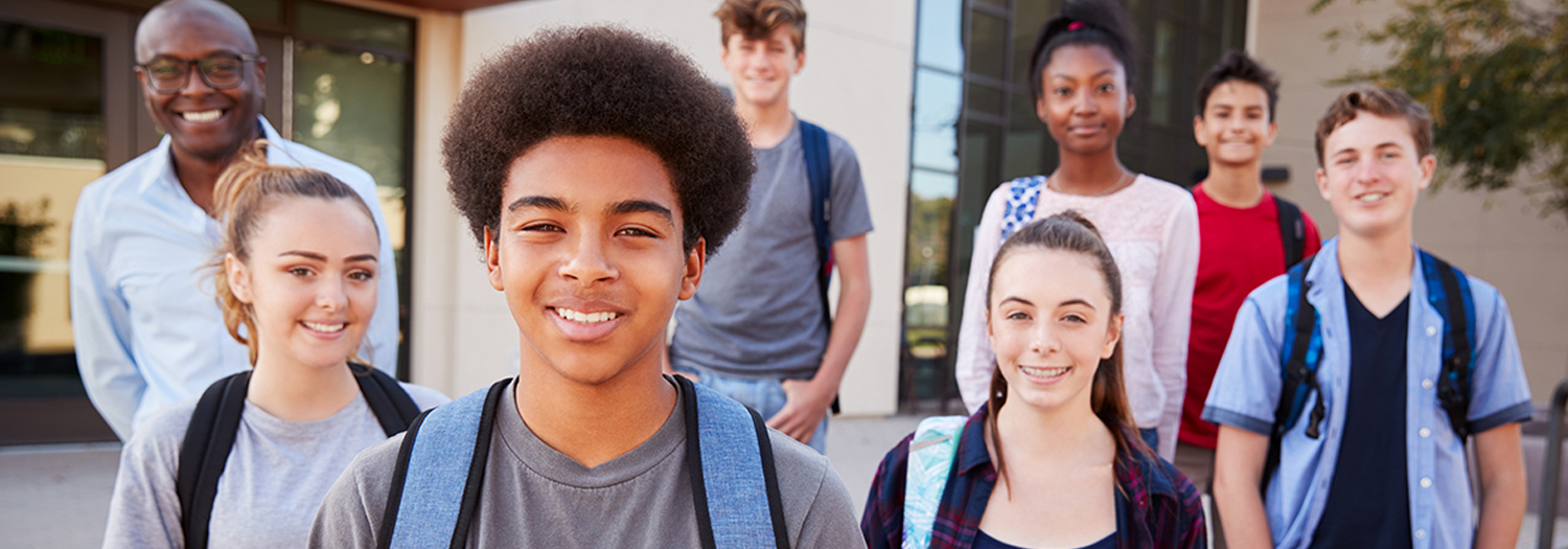 Group of young students smiling with an instructor
