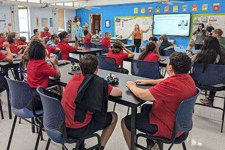 students in a classroom sitting at desks