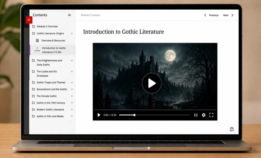 A  laptop sits on a wooden desk displaying a learning management system page labeled “Module 2 Lessons.” The main heading reads “Introduction to Gothic Literature (12:34).” In the center, a video player shows a dark image of a Gothic castle at night under a full moon, with playback controls and a timestamp bar visible. On the left, a simplified “Contents” sidebar lists literature-focused modules, including “Module 2 Overview,” “Gothic Literature: Origins,” and several subtopics. Under “Gothic Literature: Origins,” a selected item with a small multicolored Kaltura icon reads “Introduction to Gothic Literature (12:34).