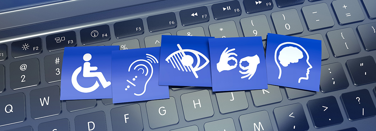 keyboard with 5 tiles on keyboard letters depicting person in wheel chair, hearing impaired, visually impaired, sign language, and cognitive impairment