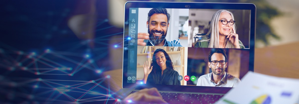 laptop with a web conferencing meeting open, images of four people sharing video from their webcams