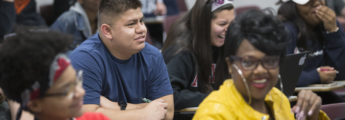 students in a classroom talking with one another