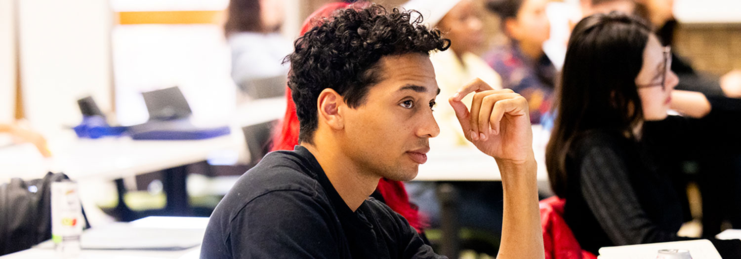 Student listening to lecture in classroom