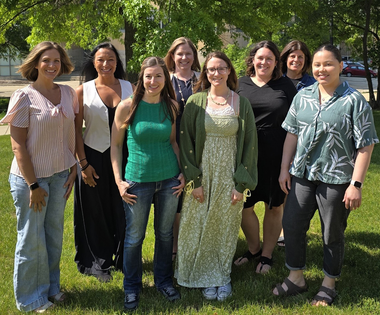 Group picture outside in the grass of the PESP-NI program's third cohort