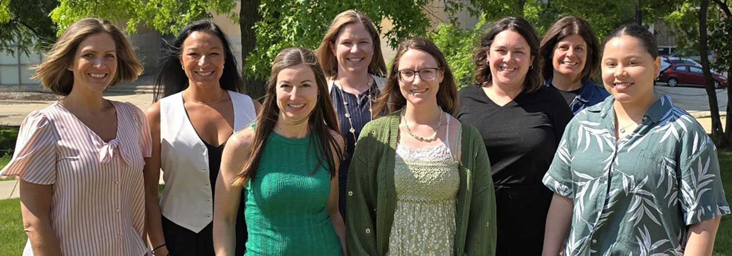 Group picture outside in the grass of the PESP-NI program's third cohort