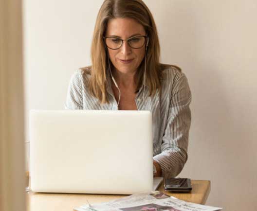 woman typing on a laptop