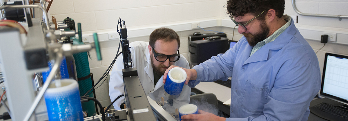 A student and professor in a laboratory