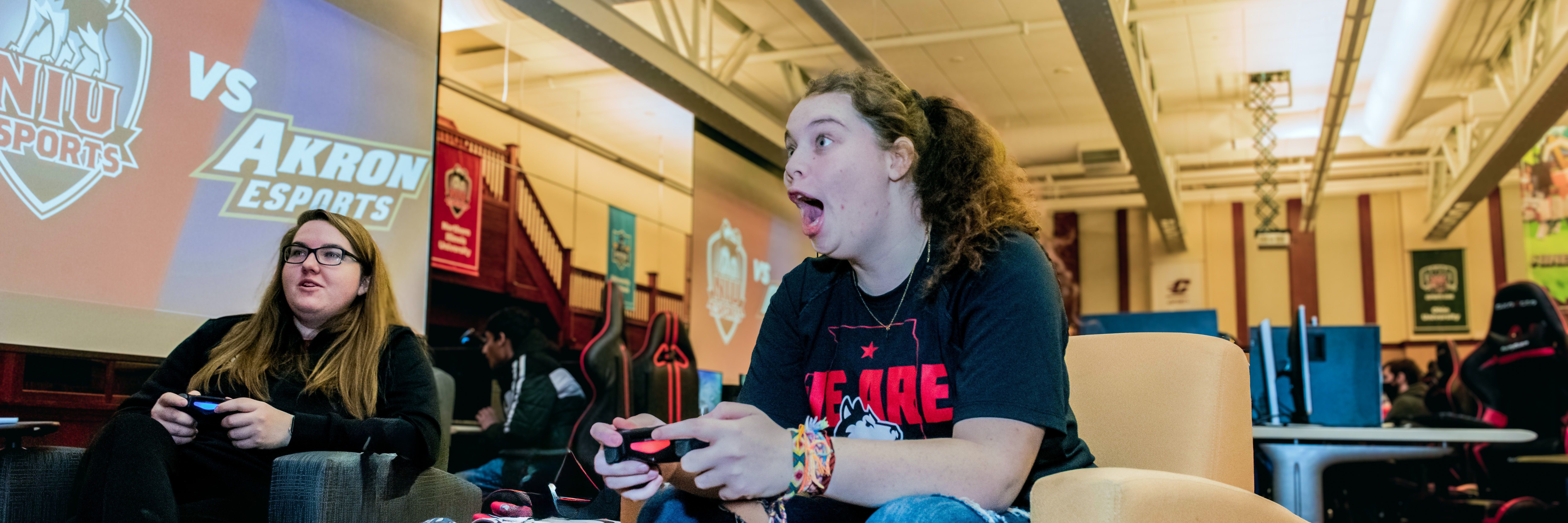 Excited student plays video games in the esports arena