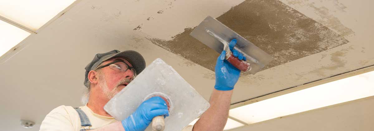 worker-patching-drywall