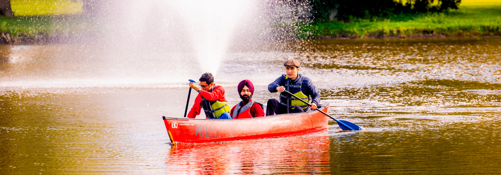 Students canoeing in lagoon