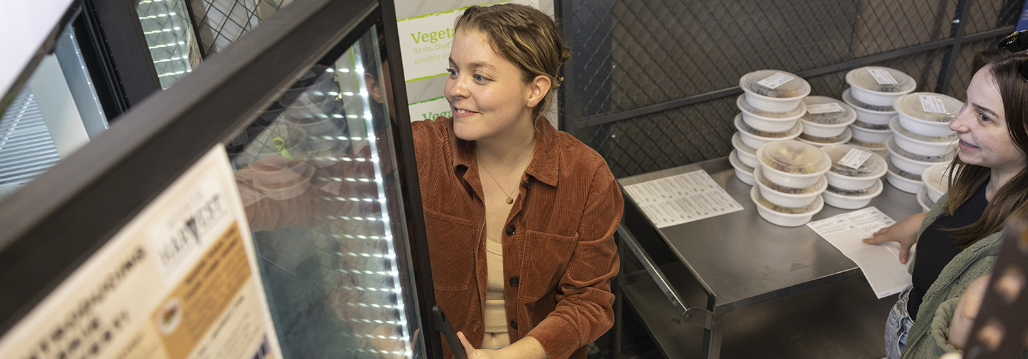 Volunteer taking meals out of cooler