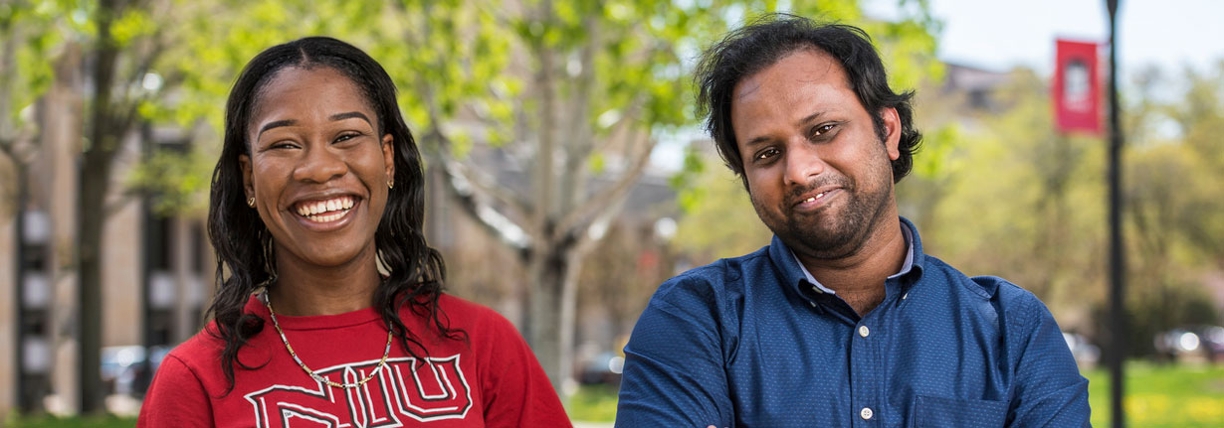 Kedisha Dallas and Rajarshi Sen, two international students, smiling on campus
