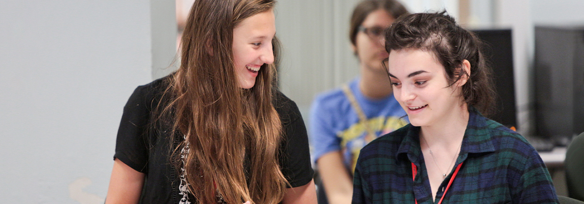 two high school students at summer camp