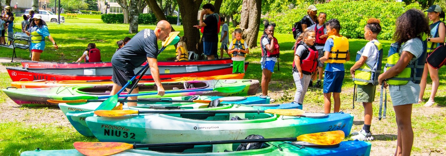 Students with canoe instructor at NIU Lagoon