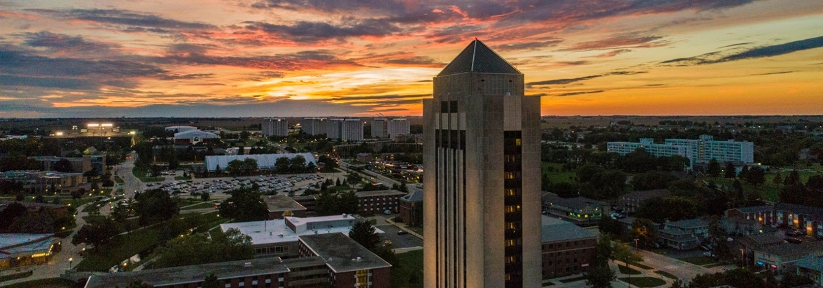Holmes Student Center tower with sunset sky in background