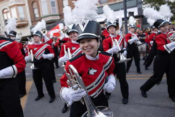 Clare performing with the NIU marching band in downtown DeKalb