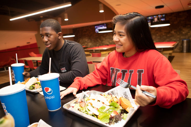Students eating at Huskie Den Grill