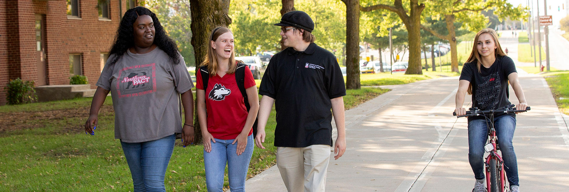 Group of NIU students walking on campus 