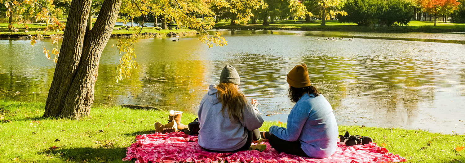 Students on blanket near East Lagoon