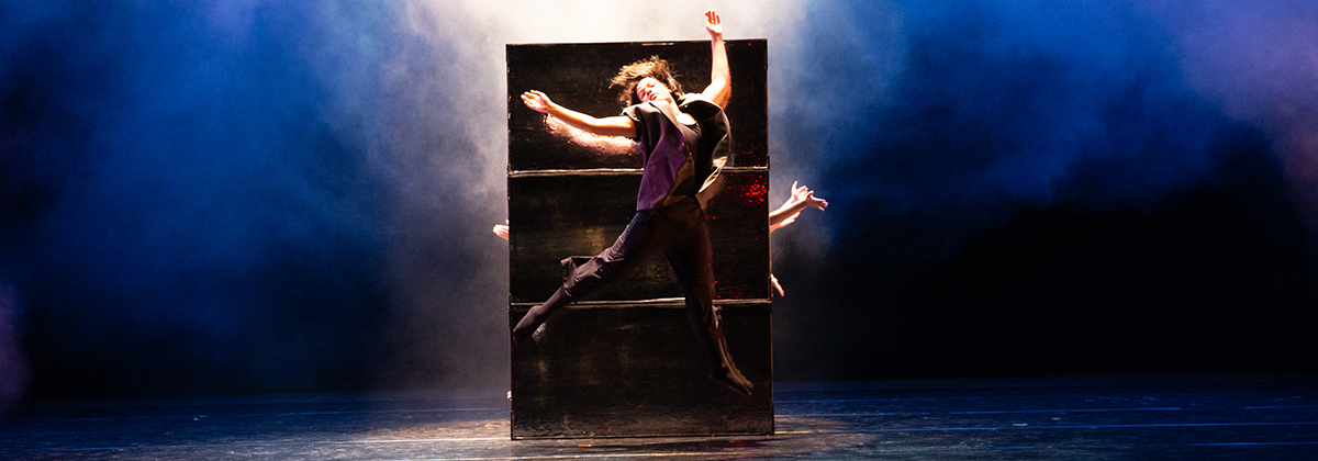 Dancer in mid jump performing modern dance