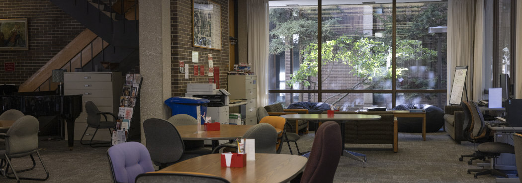 panorama of music library showing couches, study tables, and public computers